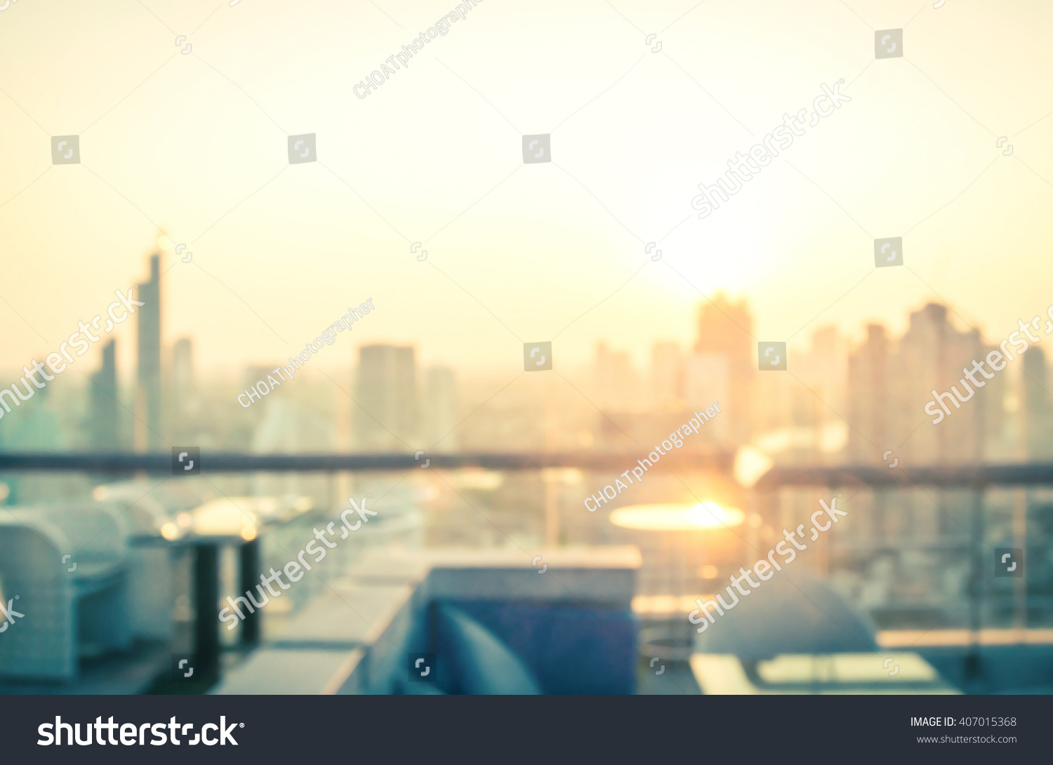 Rooftop party concept: Blurred dining table restaurant with beautiful city view at twilight scene background. Bangkok, Thailand, Asia #407015368