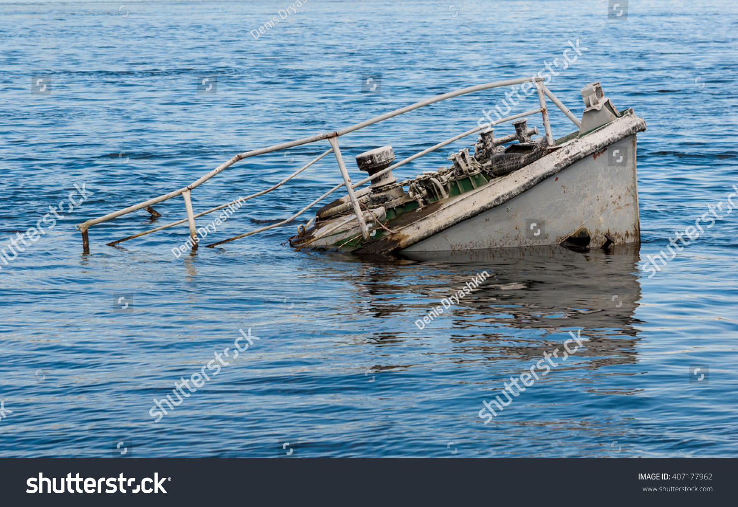 Rusty boat wreck in a blue river #407177962