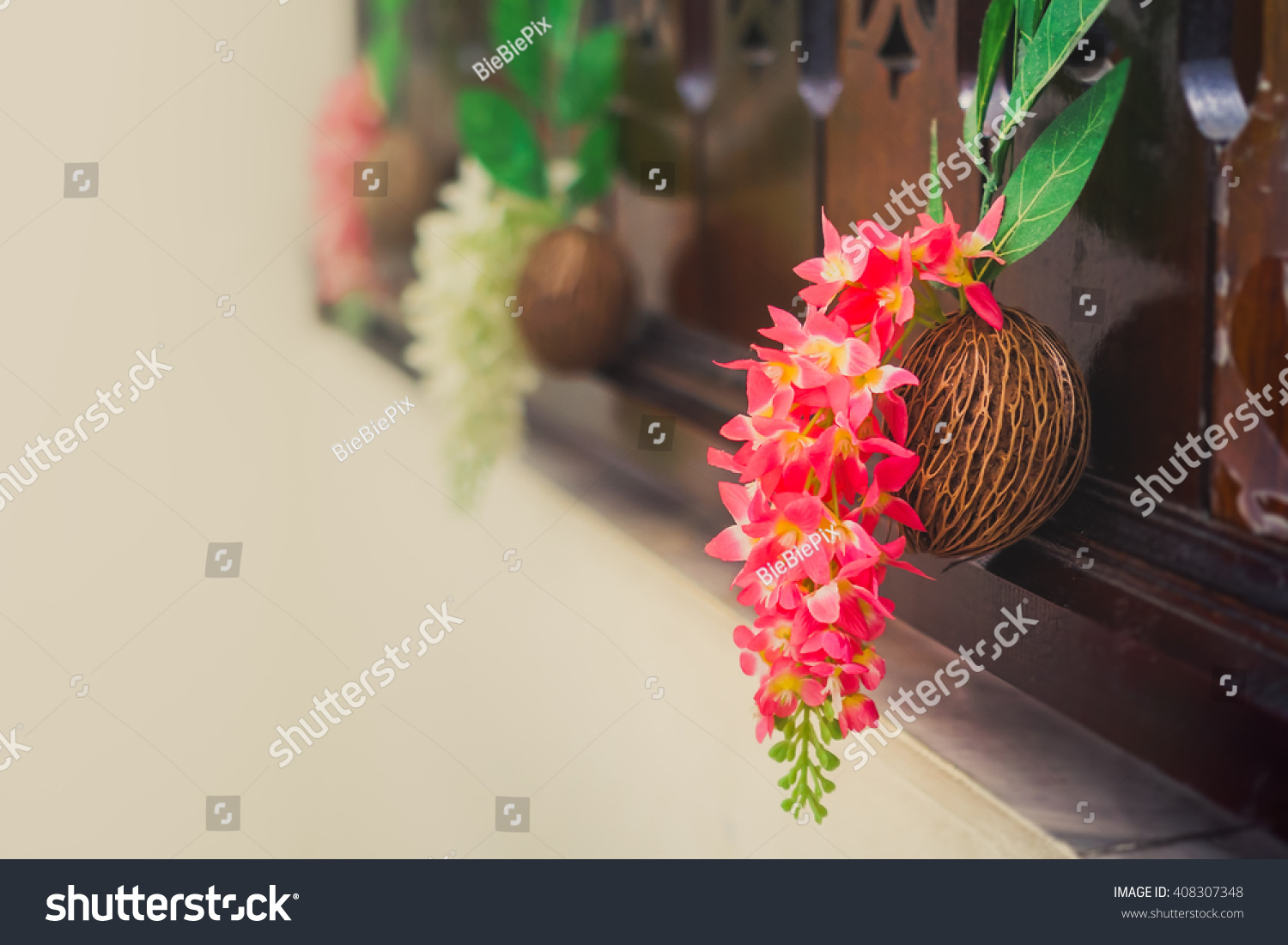 Beautiful spring bouquet of orchids on the dried Pong pong seeds (commonly known as Othalanga, Suicide tree, Buddha palm plant and Cerbera odollam). #408307348