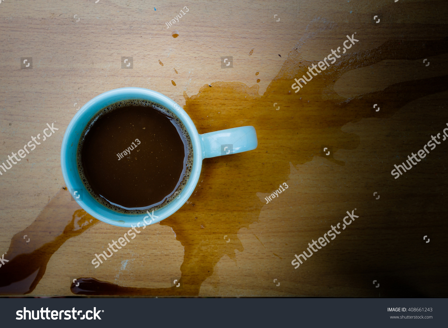 Still life cup of coffee spilled out on wooden desk #408661243
