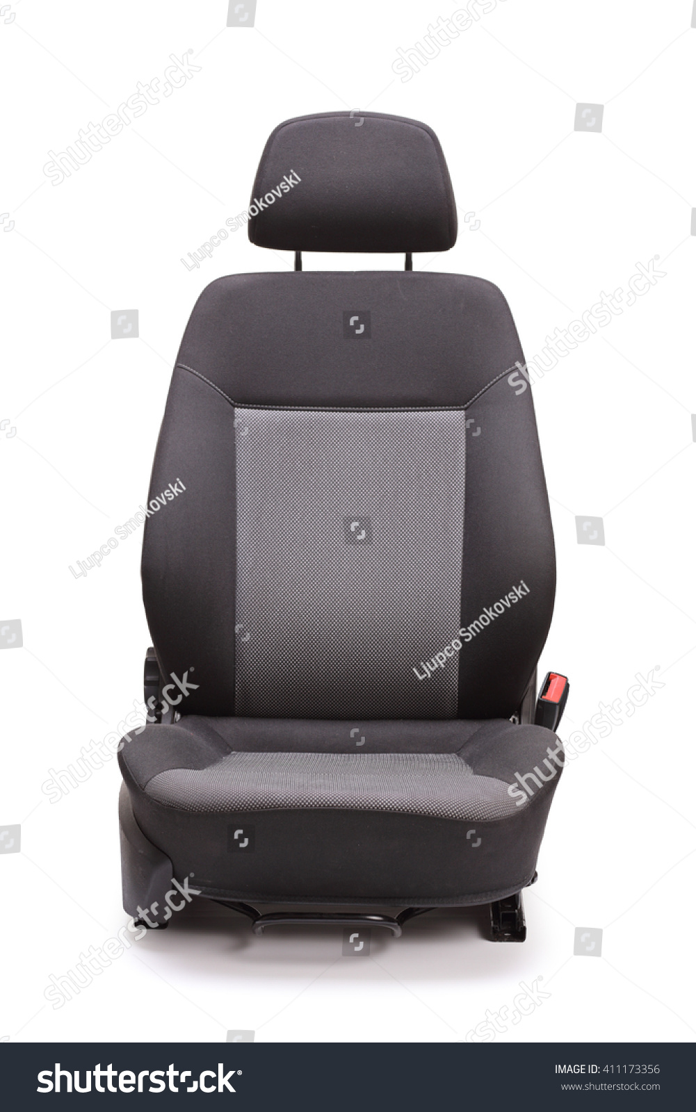 Vertical studio shot of a brand new black car seat isolated on white background #411173356