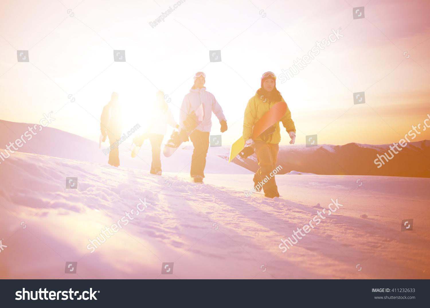 Group of snowboarders on top of the mountain. #411232633