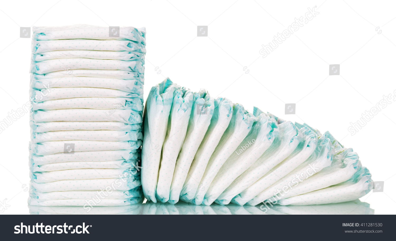 Stacks of diapers for children isolated on white background. #411281530