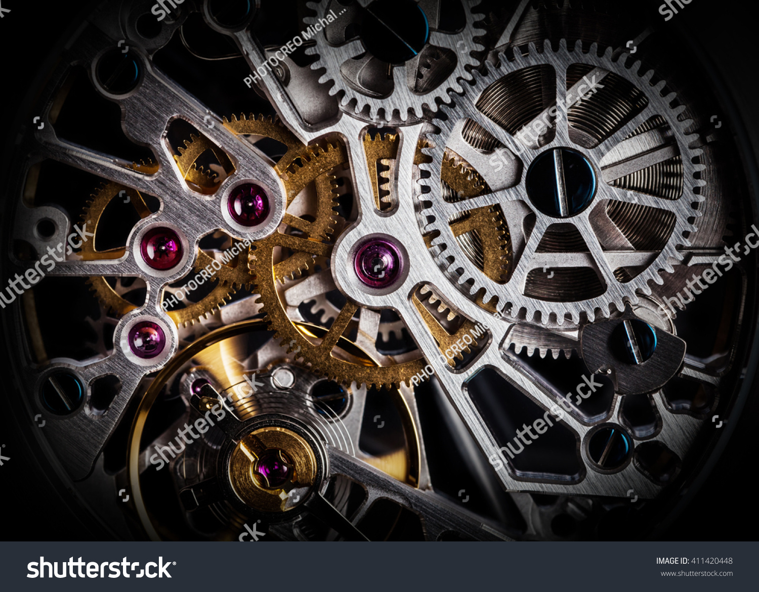 Mechanism, clockwork of a watch with jewels, close-up. Vintage luxury background. Time, work concept. #411420448