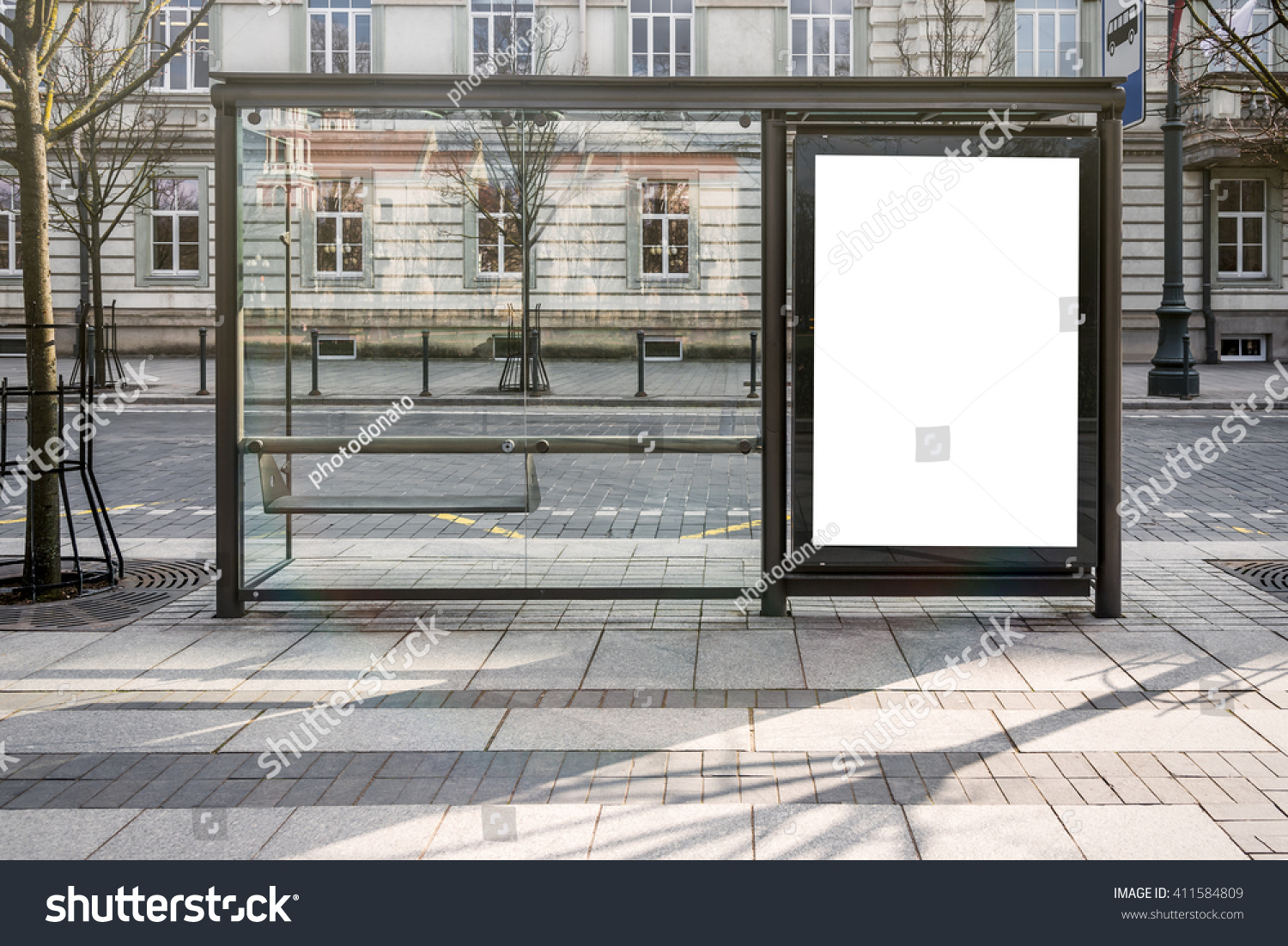 Blank white mockup of bus stop vertical billboard in front of empty street background #411584809
