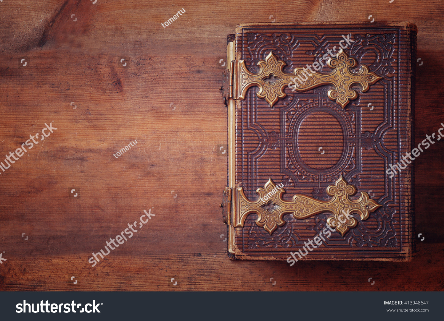 top view of antique book cover, with brass clasps. vintage filtered and toned

 #413948647