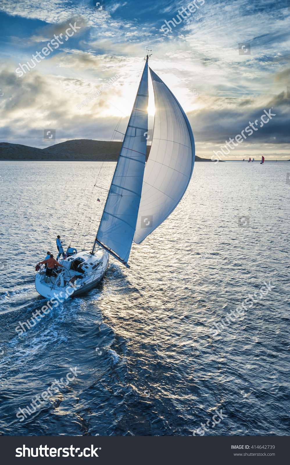 Sailing boat in light wind from bird`s eye view #414642739
