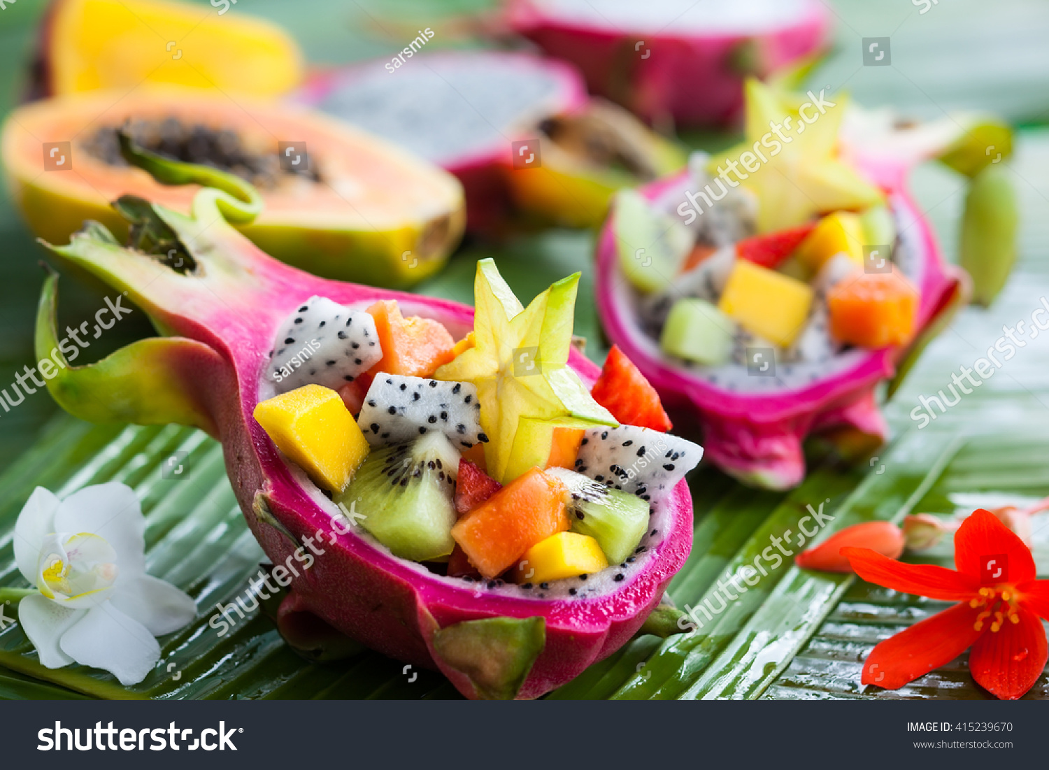 Exotic fruit salad served in half a dragon fruit #415239670