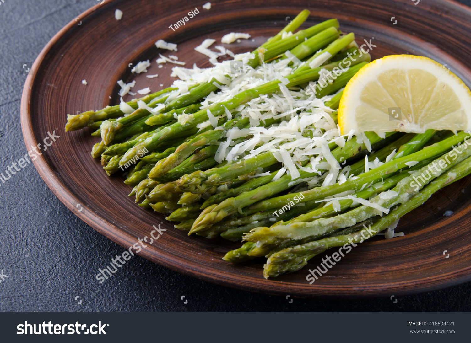 Asparagus with lemons and cheese. Top view #416604421