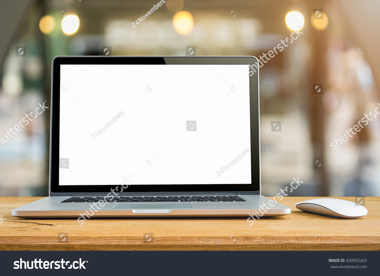 Conceptual workspace, Laptop computer with blank white screen on table, blurred background. #420932263