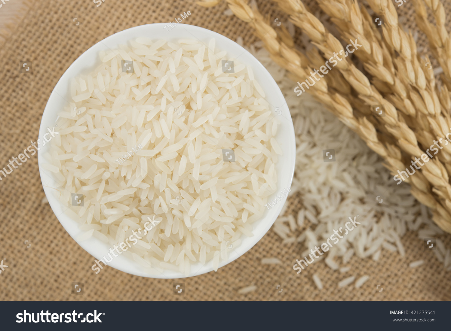 rice grain in white bowl on table. #421275541