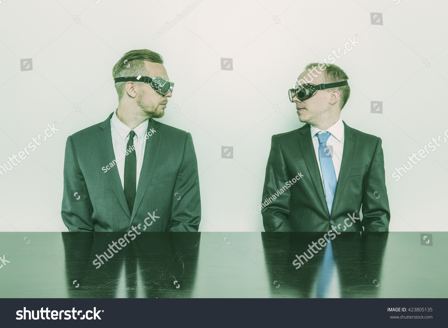 Two businessman sitting at office desk #423805135