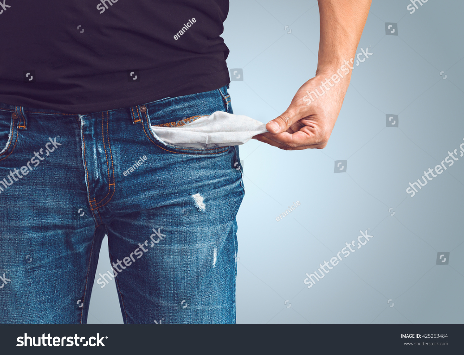 Poor man in jeans with empty pocket #425253484