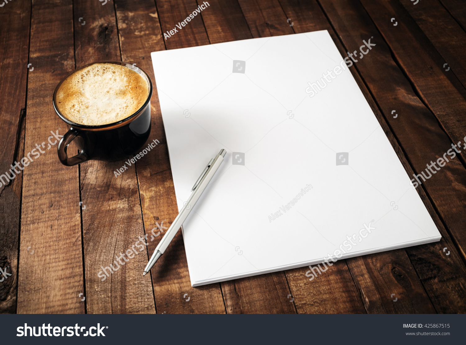 Blank branding template on vintage wooden table background. Letterhead, coffee cup and pen. Photo of blank stationery. Mock-up for design portfolios. #425867515