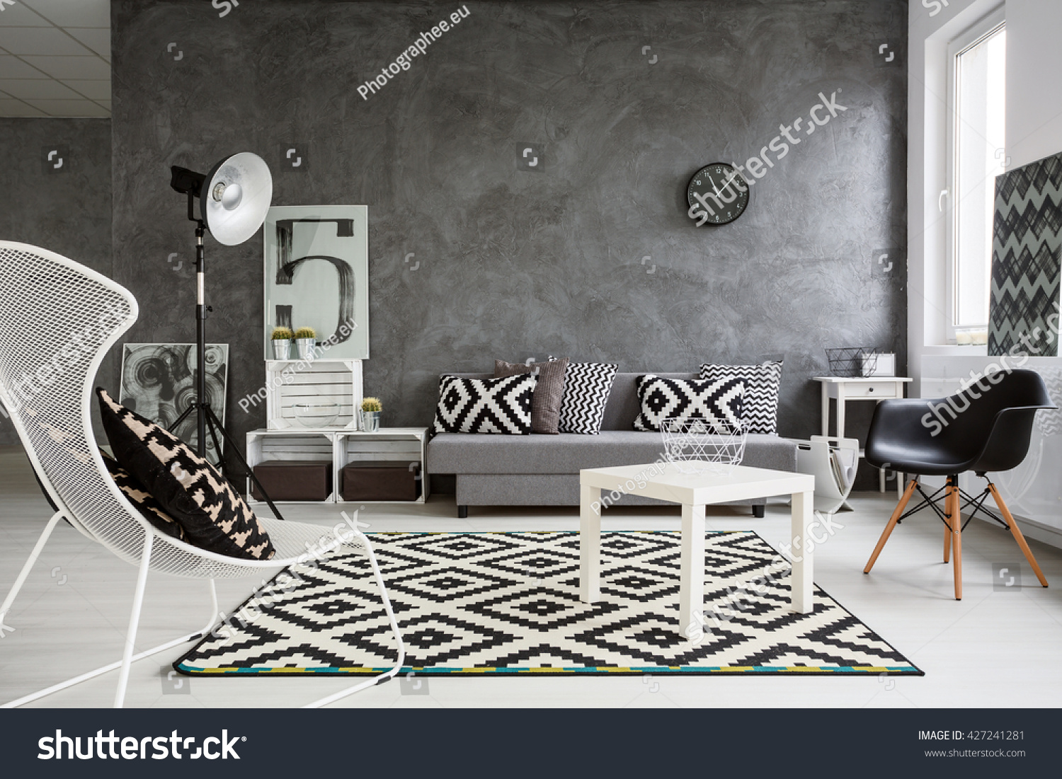 Spacious classic living room in black and white. Interior designed with style #427241281