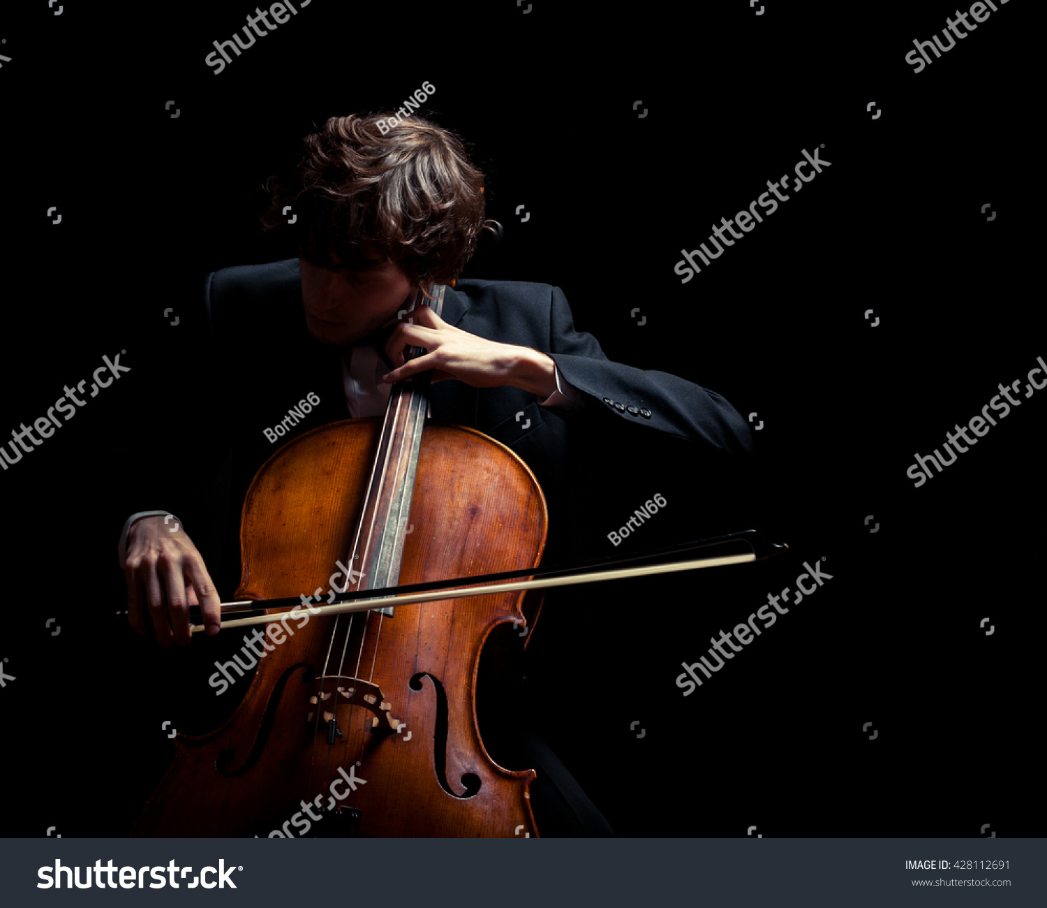 musician playing the cello. Black background #428112691
