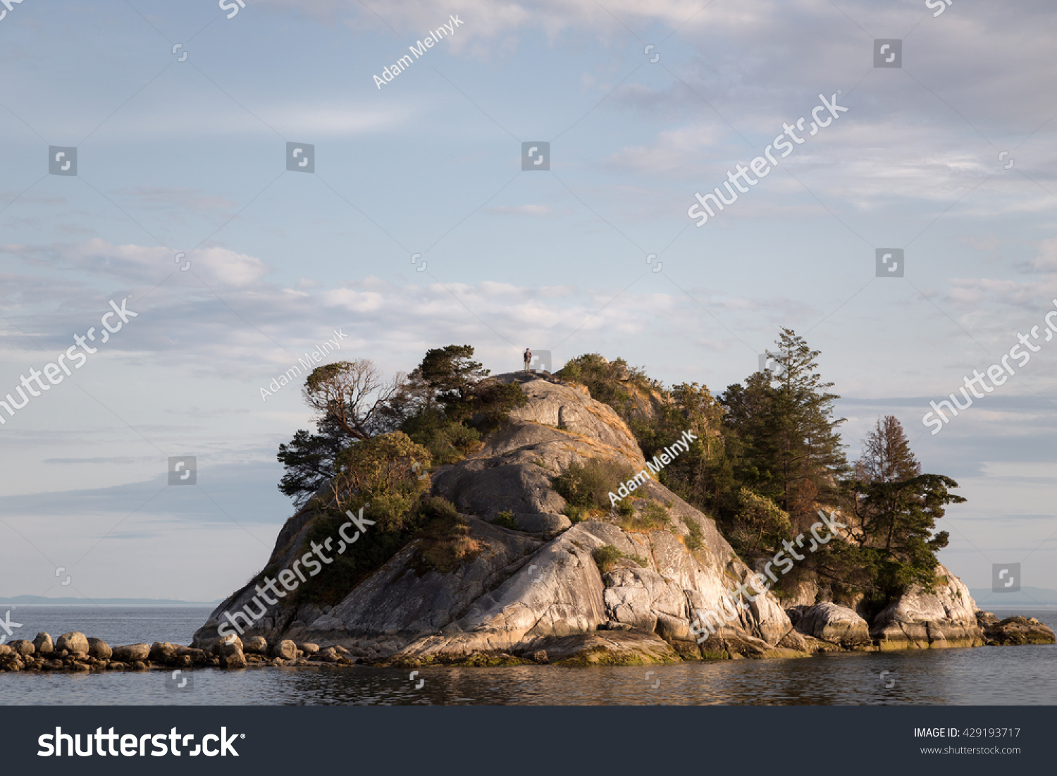 Perspective view of a man isolation at the top of a small island. #429193717