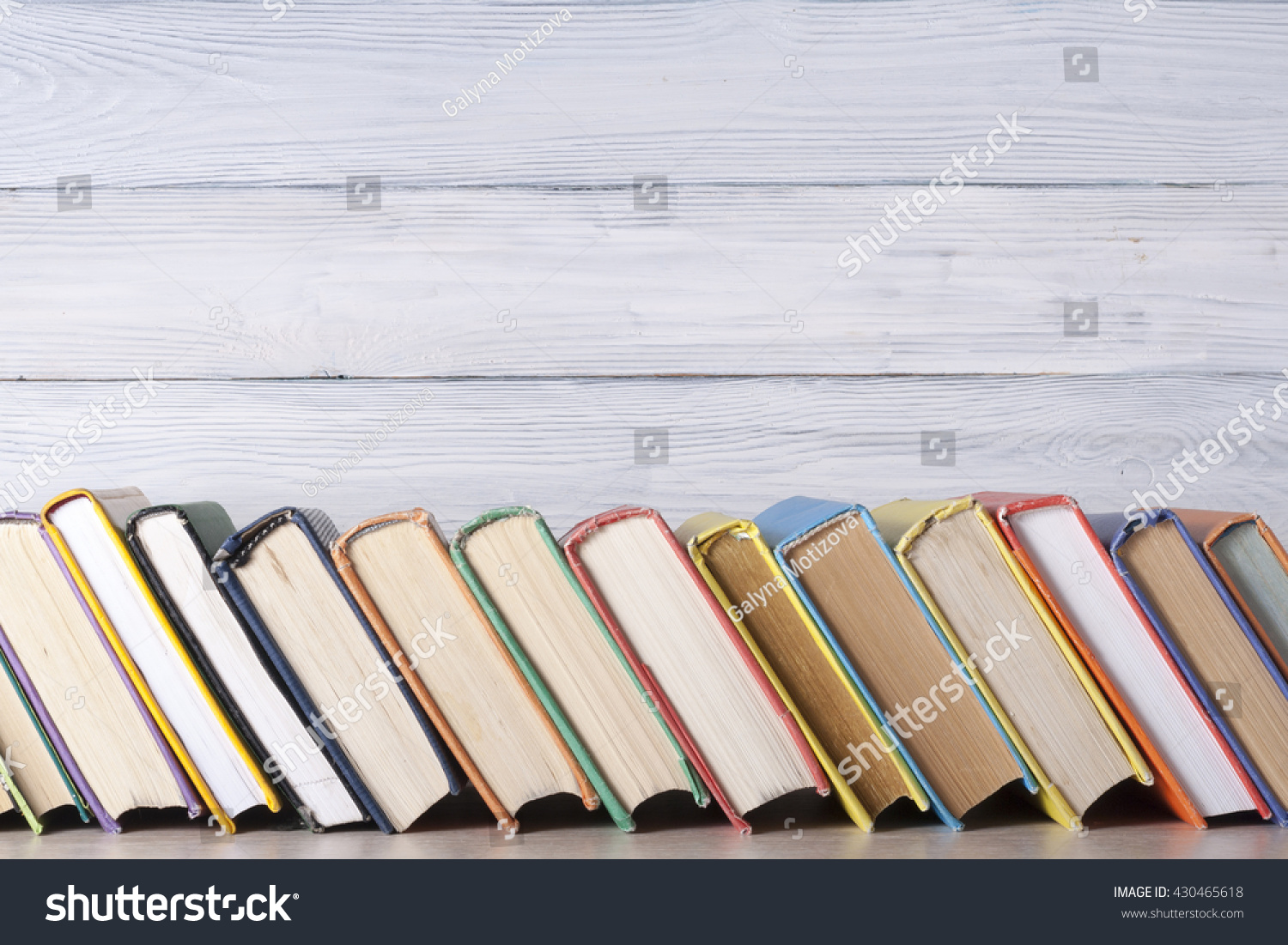 Stack of colorful books. Education background. Back to school. Copy space for text #430465618