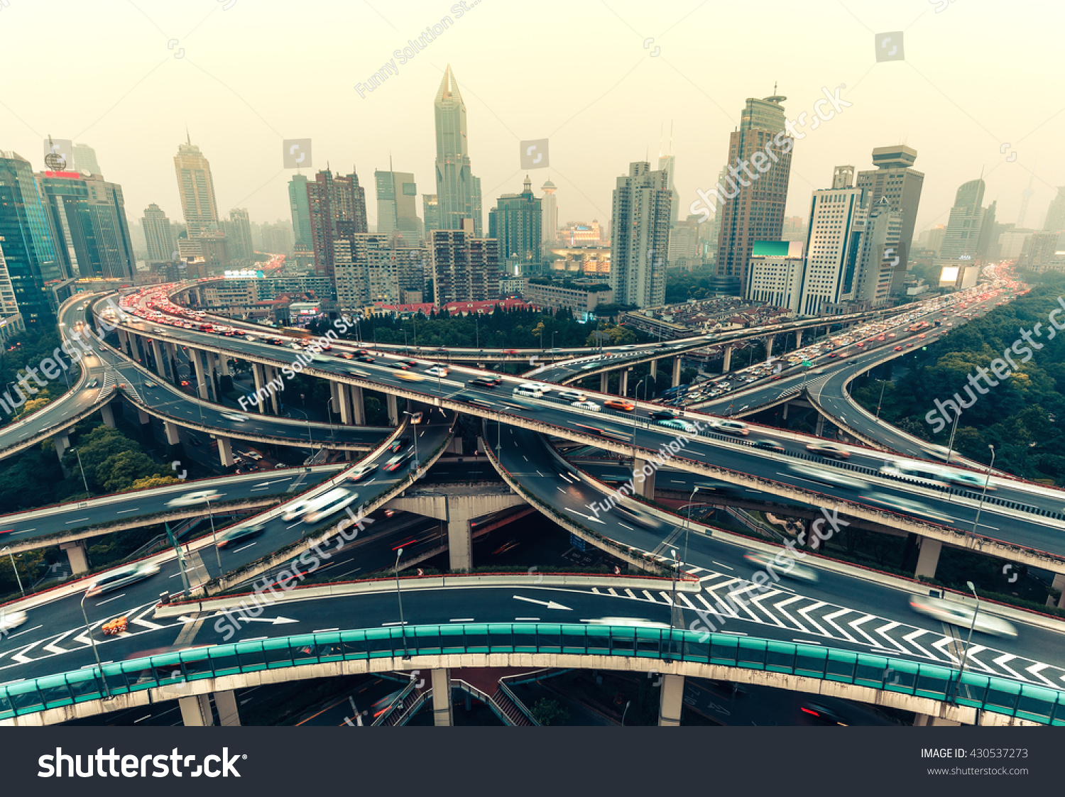 Large highway junction in Shanghai, China with traffic. Famous landmark of Shanghai in the evening. #430537273
