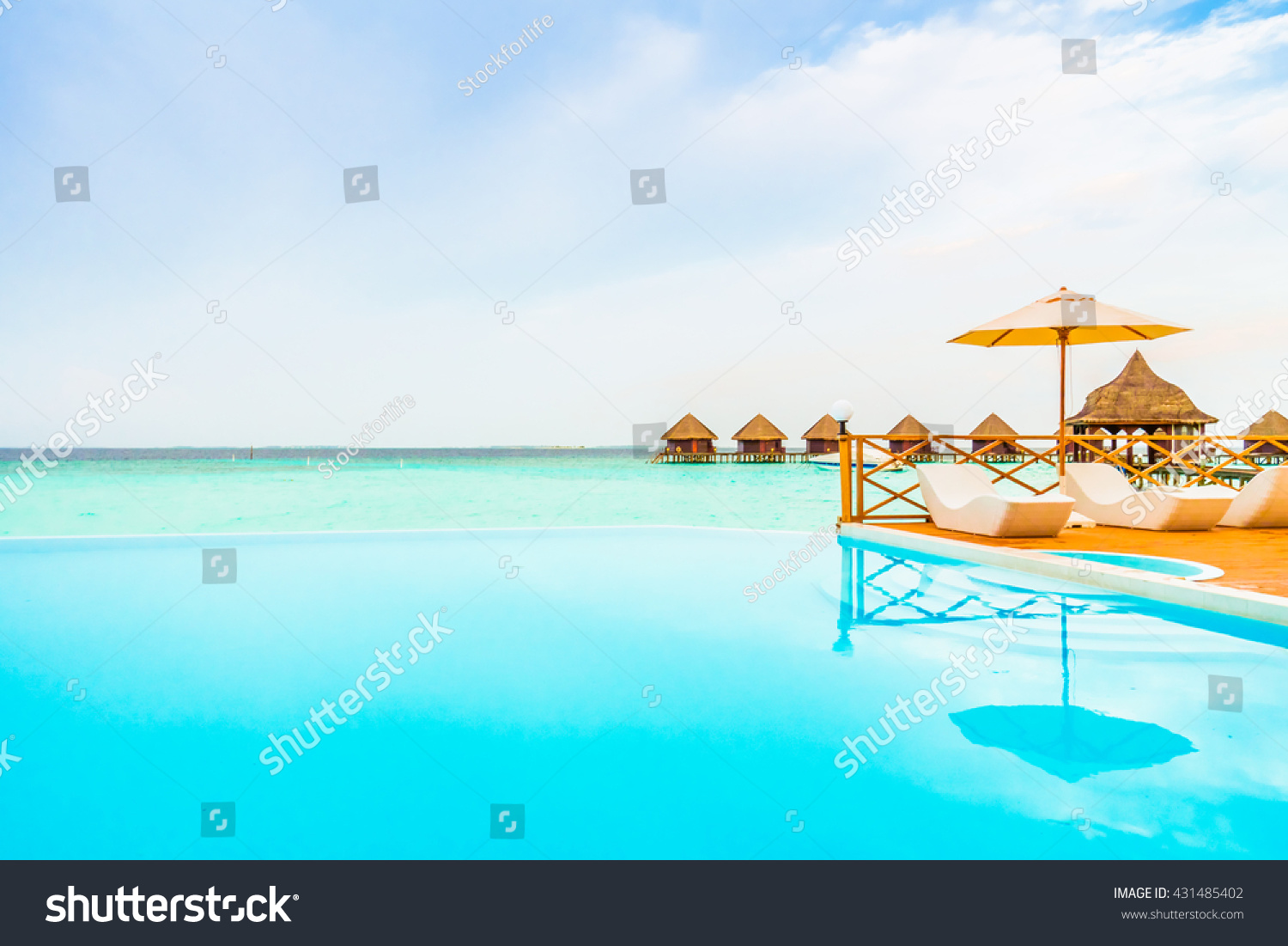 Outdoor swimming pool in Beautiful tropical Maldives island resort with beach and sea for nature holiday vacation background concept - Boost up color Processing #431485402