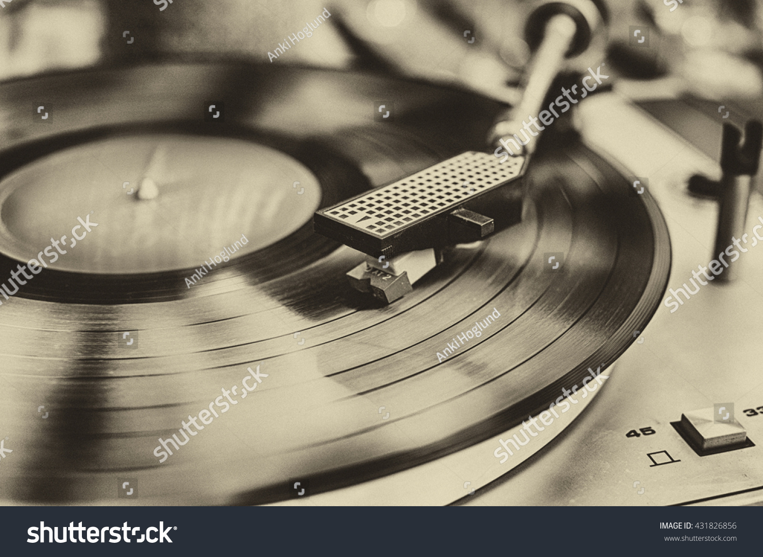 Textured retro image in sepia of vinyl record player. #431826856