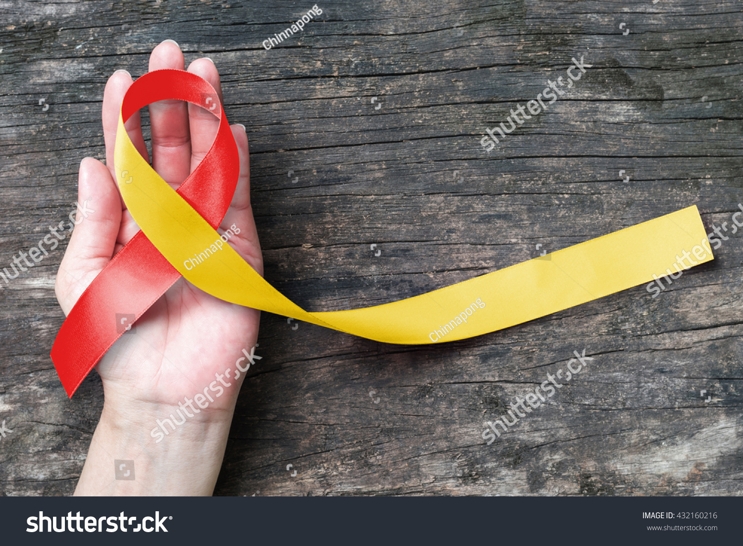 Red yellow ribbon awareness on helping hand for World hepatitis day, HIV/ HVC co-infection    #432160216