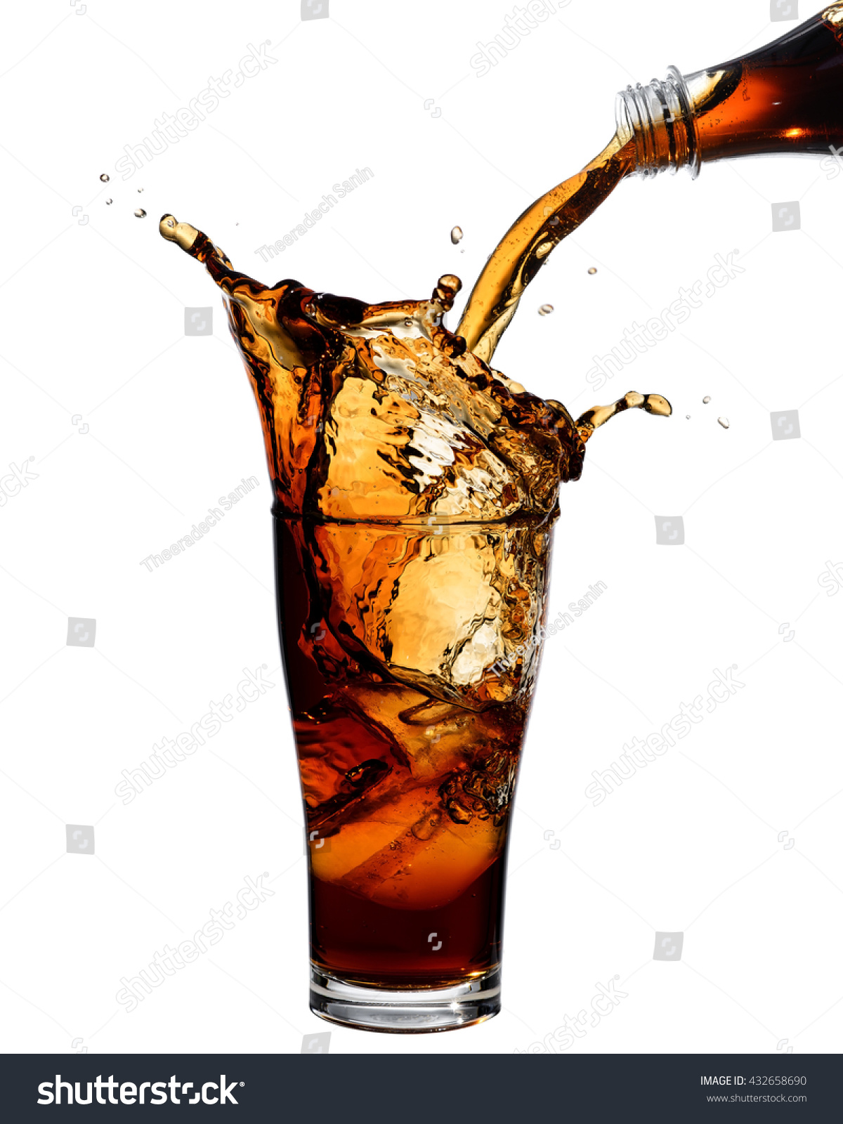 Pouring cola from bottle into glass with splashing., Isolated white background. #432658690