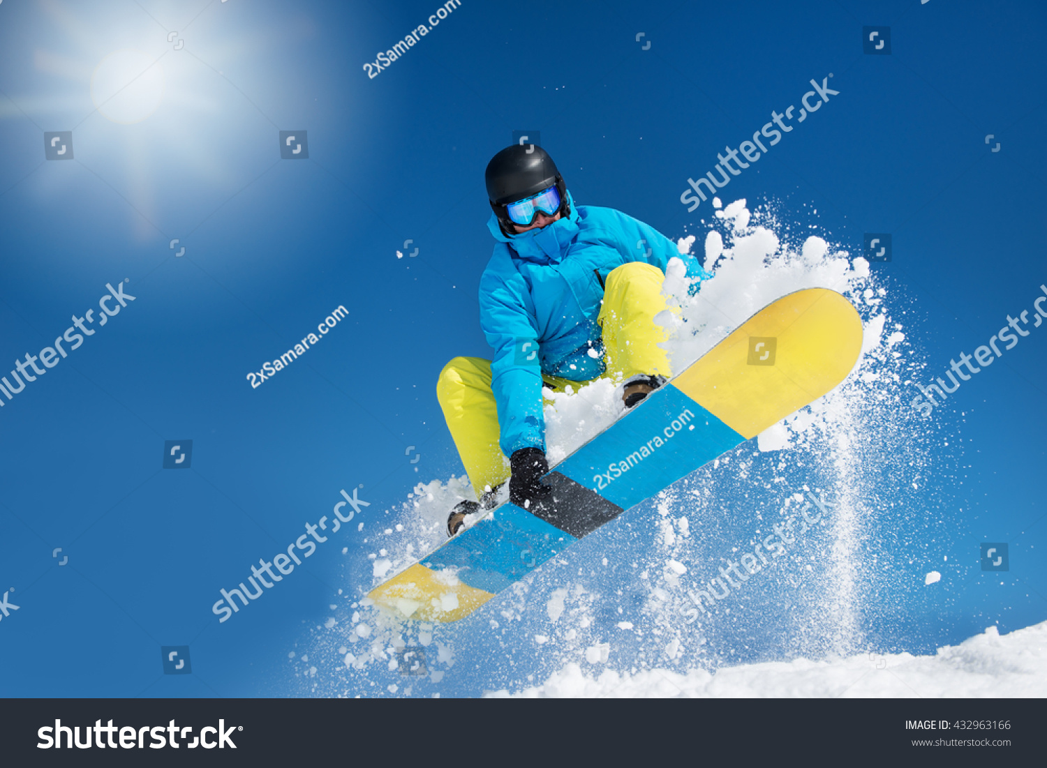 Active snowboarder in the air hitting a jump #432963166