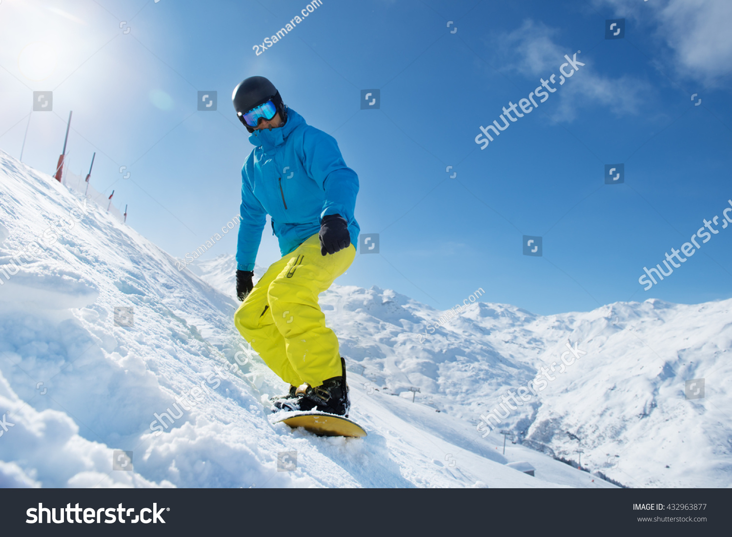 Recreation vacation at a ski resort - snowboarder enjoying snow in the mountains #432963877
