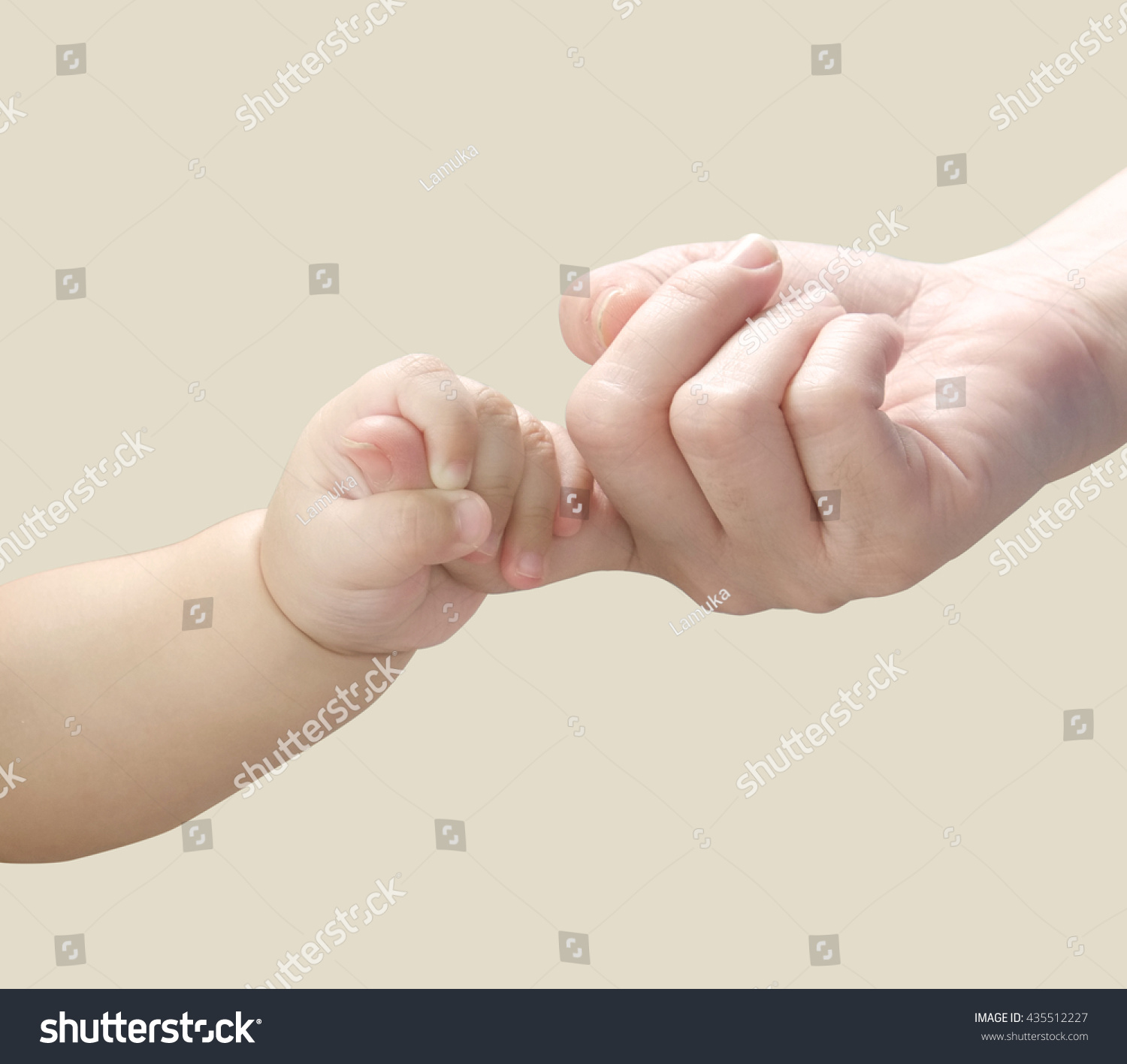 Baby hand holding mother finger. #435512227