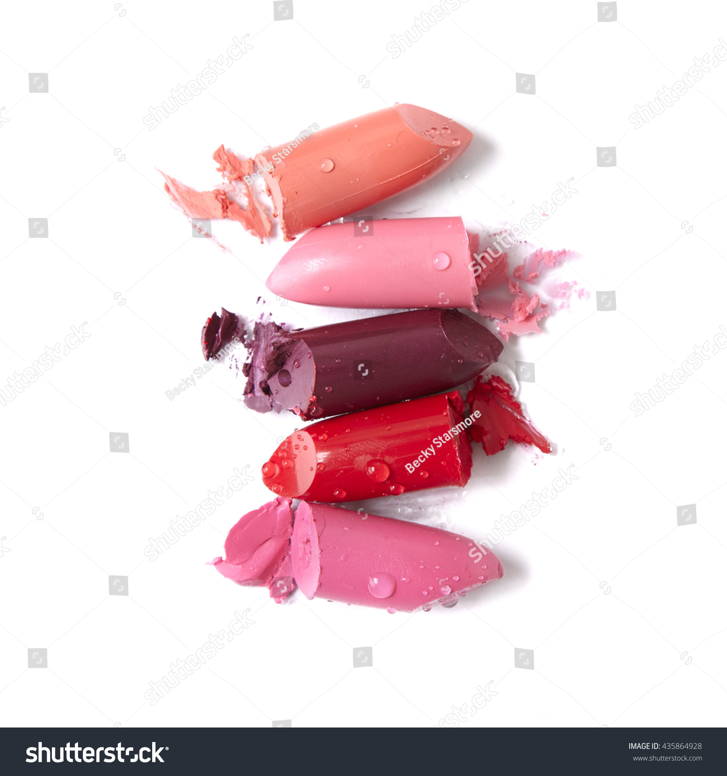 Broken lipstick make up isolated on a white background #435864928