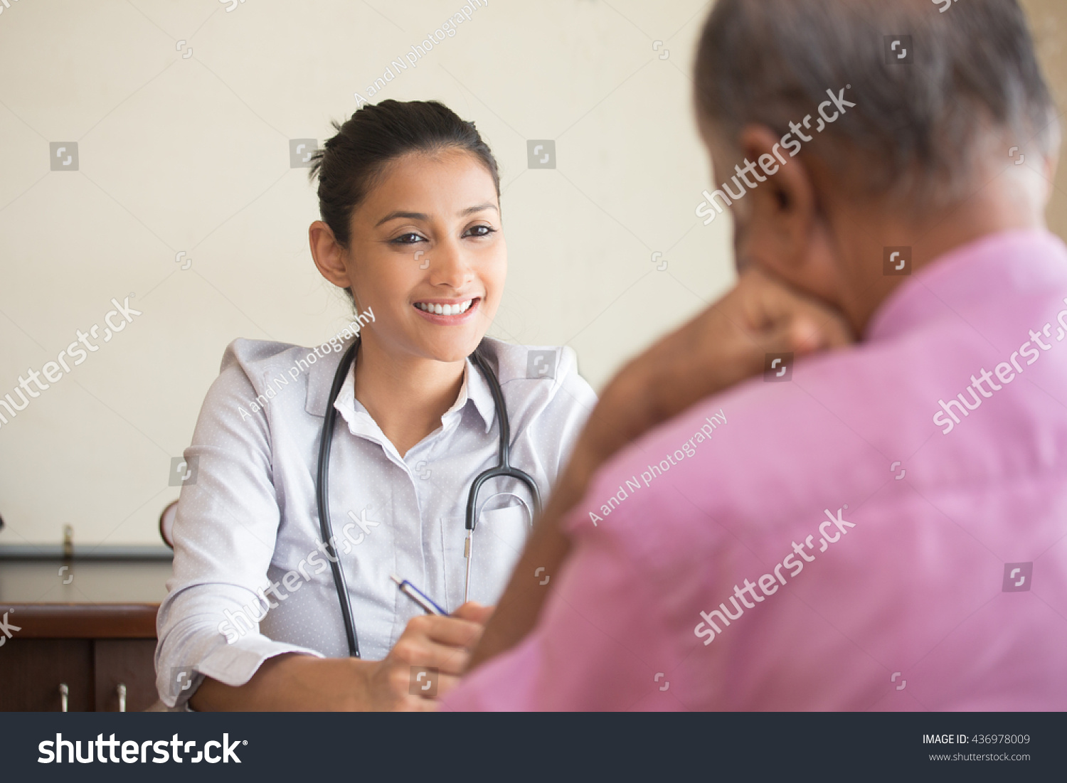 Closeup portrait, patient talking good news conversation to healthcare professional, isolated indoors background #436978009