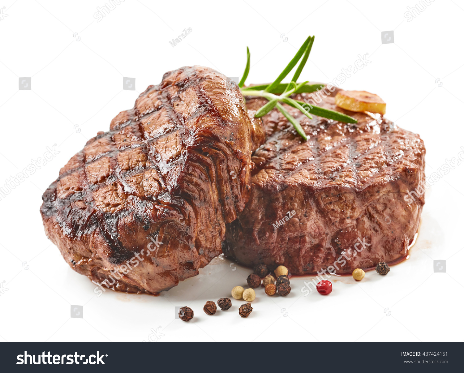 grilled beef steaks with spices isolated on white background #437424151