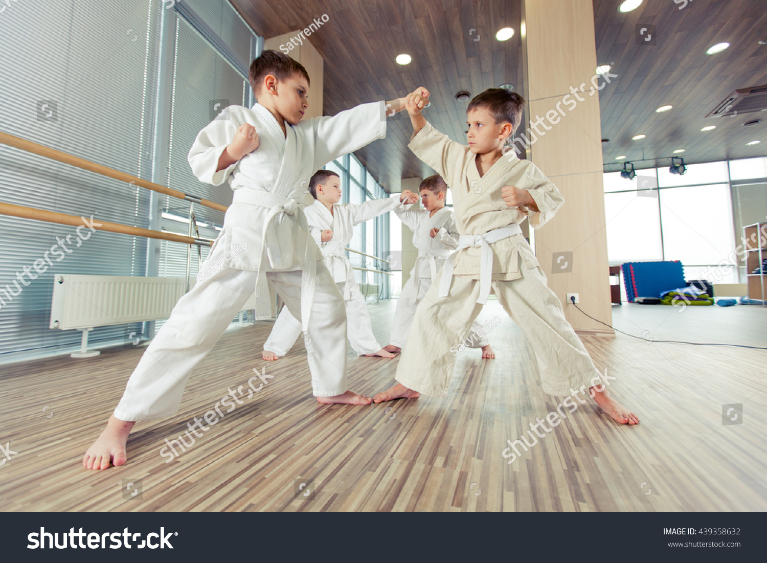 young, beautiful, successful multi ethical kids in karate position #439358632