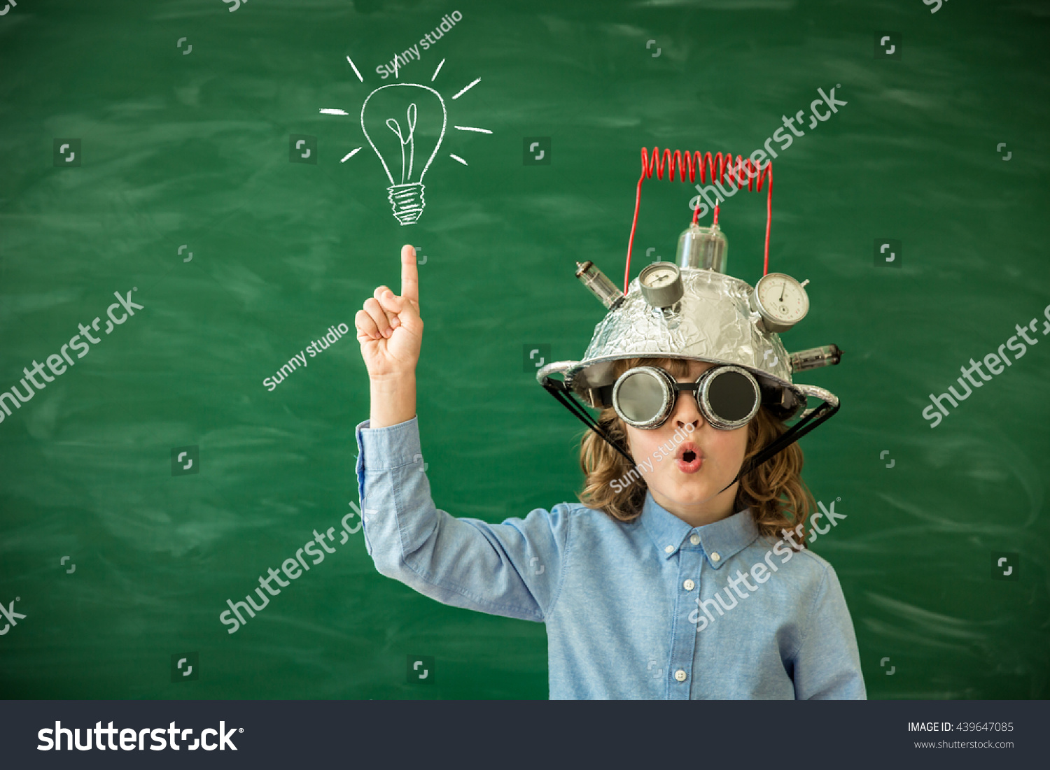 Back to school. Schoolchild with virtual reality headset. Child in class. Funny kid against blackboard. Nerd kid having fun. Geek child with VR glasses. Innovation technology and education concept #439647085
