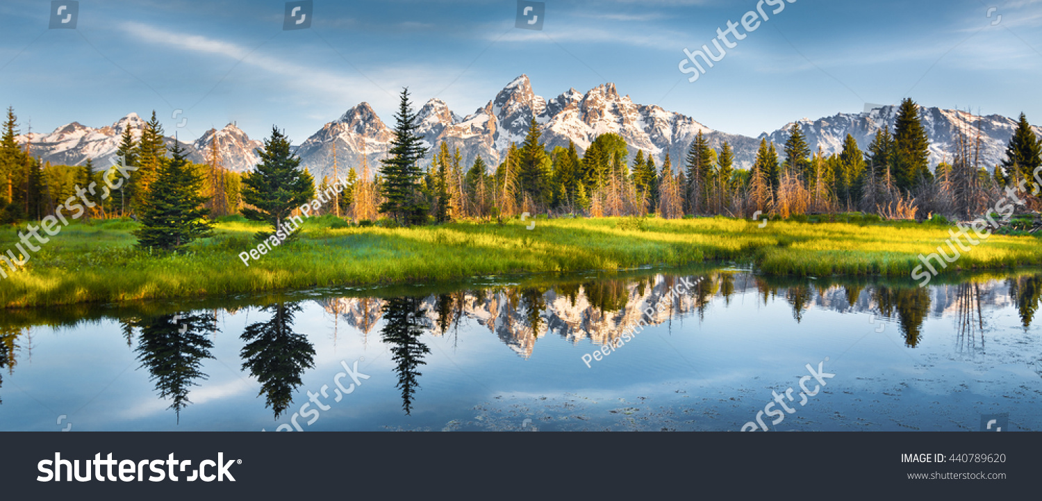 Panoramic view of Grand Teton range in Grand Teton National Park. Grand Teton National Park is in Wyoming, USA. Also, Grand Teton range is a range of mountains part of the US Rockies. #440789620