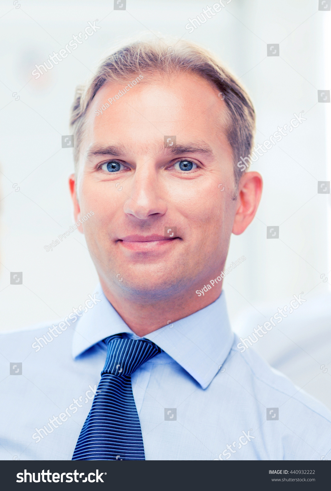 picture of smiling handsome businessman in office #440932222