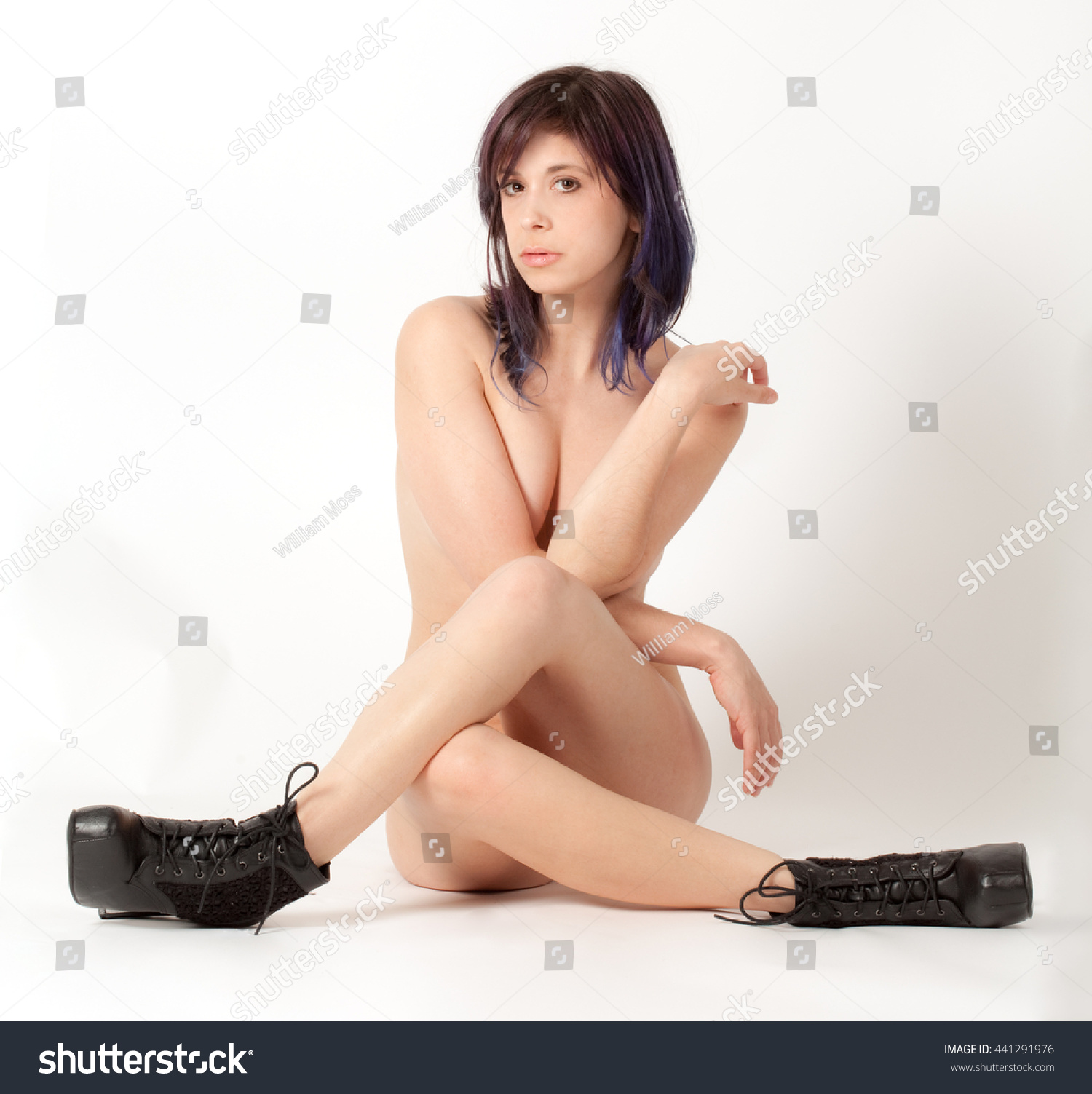 Nude woman in boots