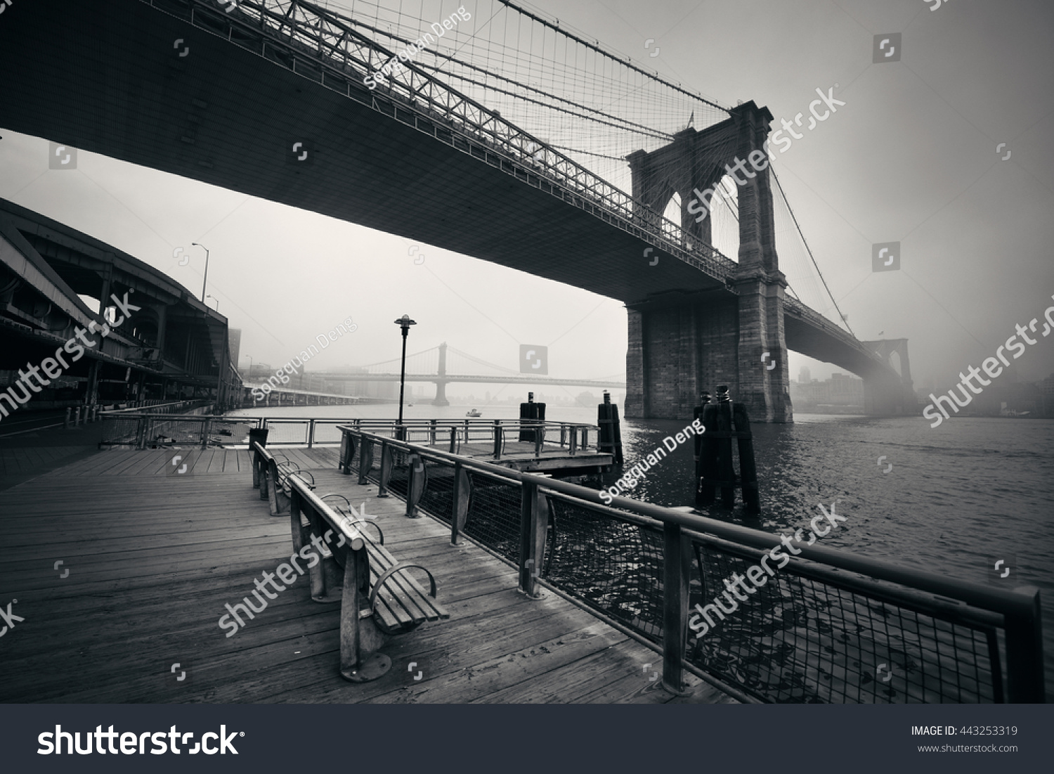 Brooklyn Bridge in a foggy day in downtown Manhattan #443253319
