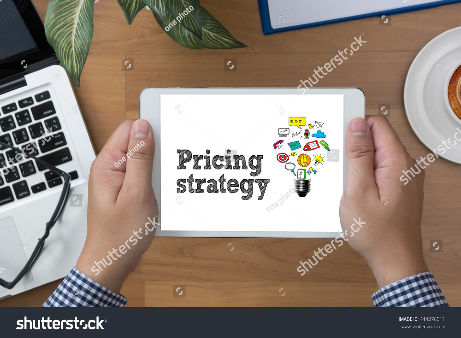 Pricing strategy  man hand Tablet and coffee cup #444276511