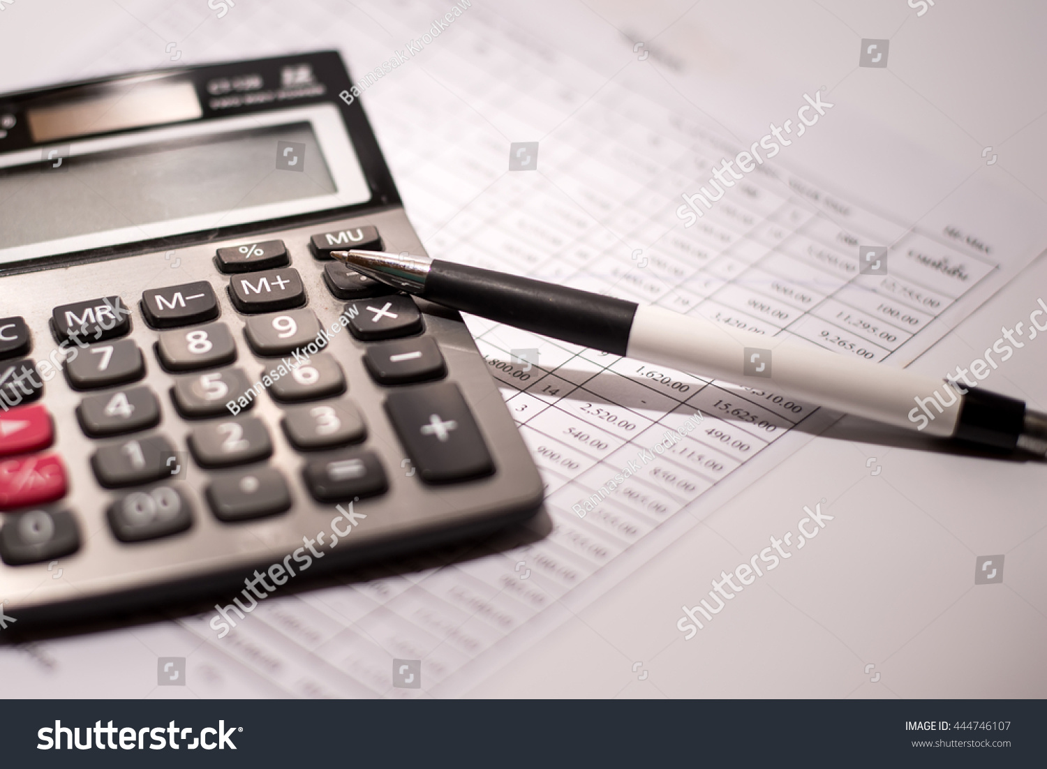 calculator and pen on a business background #444746107