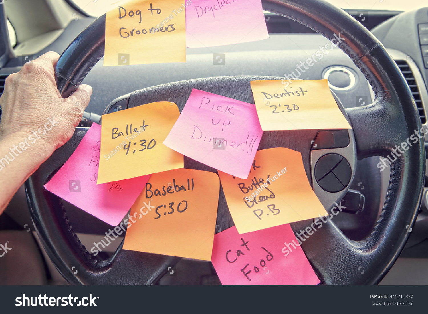 Steering wheel covered in notes as a reminder of errands to do #445215337
