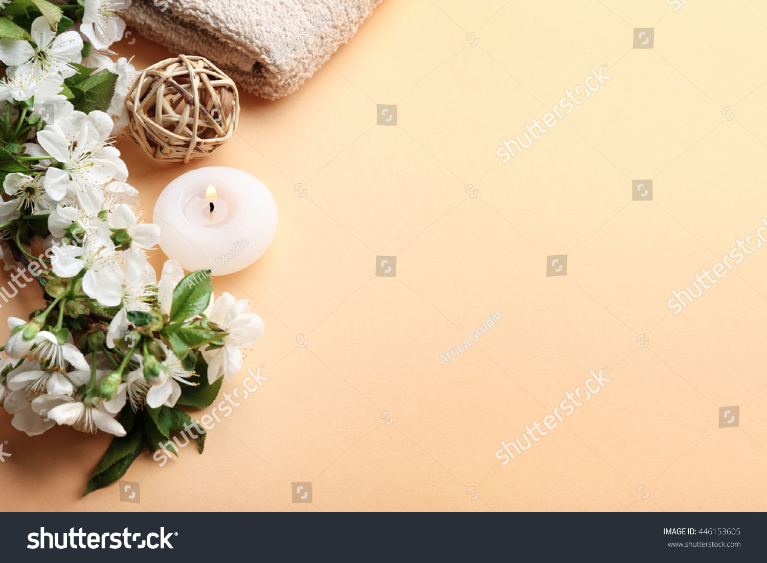 Spa treatment with blooming branch on beige background #446153605