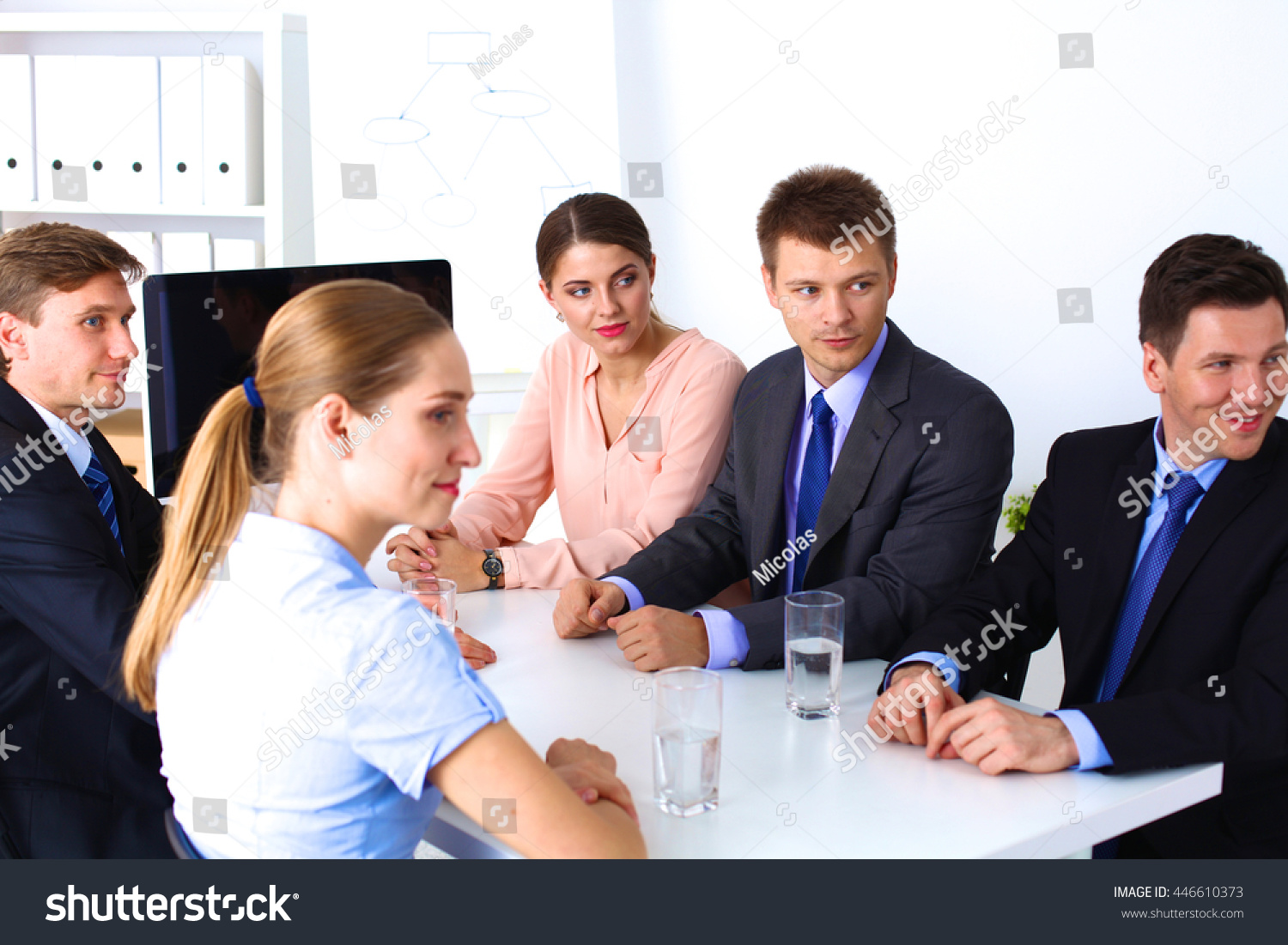 Business meeting - manager discussing work with his colleagues #446610373