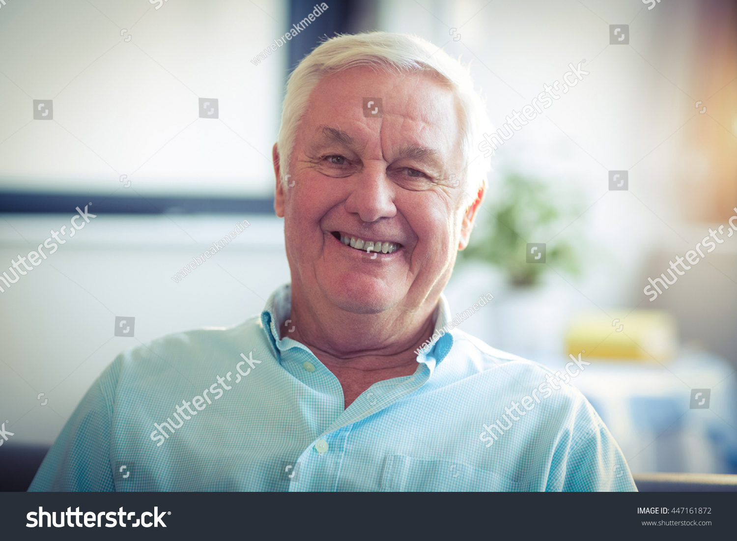 Portrait of happy senior man at home #447161872