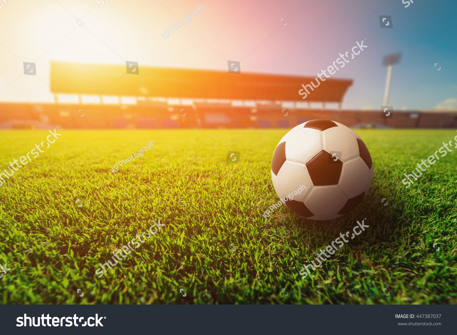 Soccer ball on grass in soccer stadium. 
 #447387037