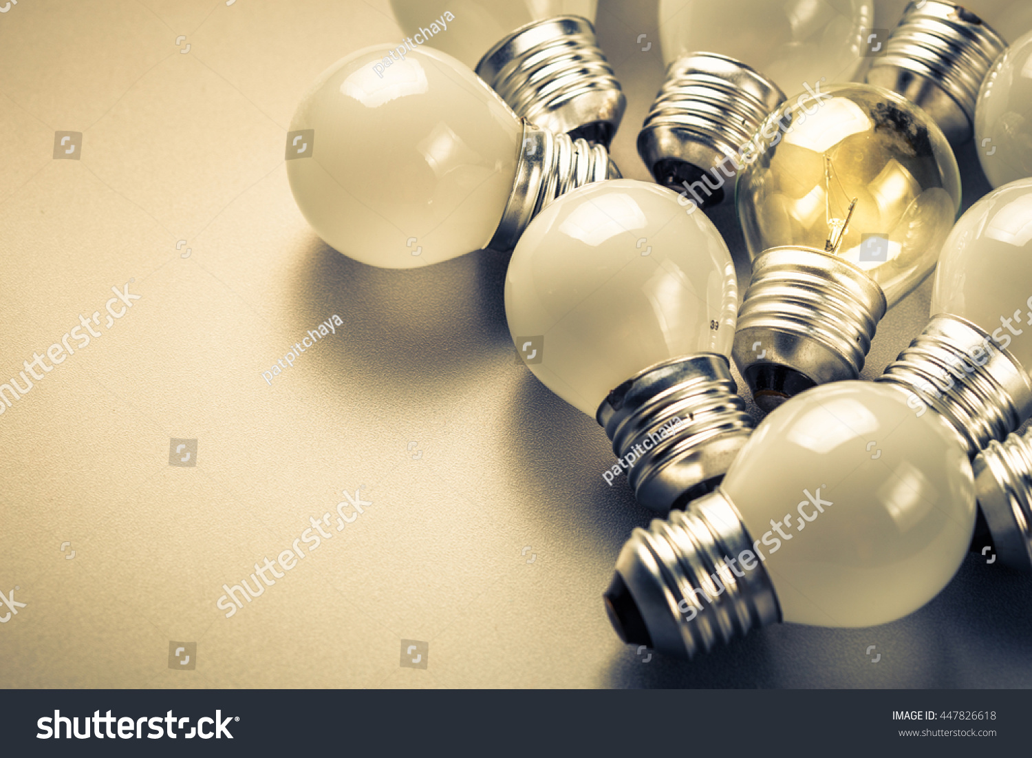 Small light bulbs and the different one glowing in the group, small business, original idea concept #447826618