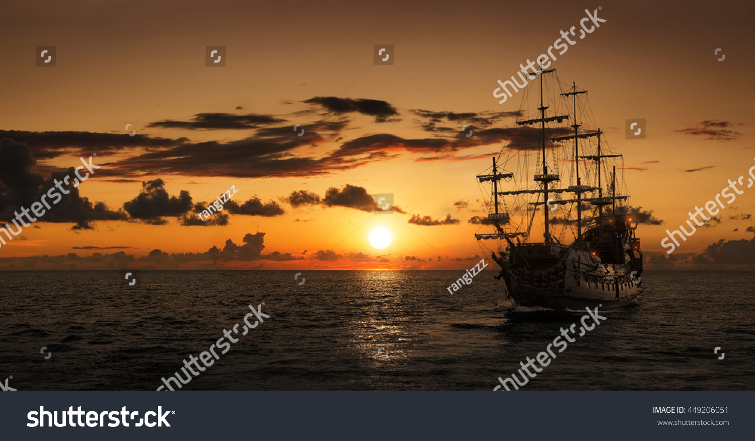 Pirate ship at the open sea at the sunset with copy space #449206051