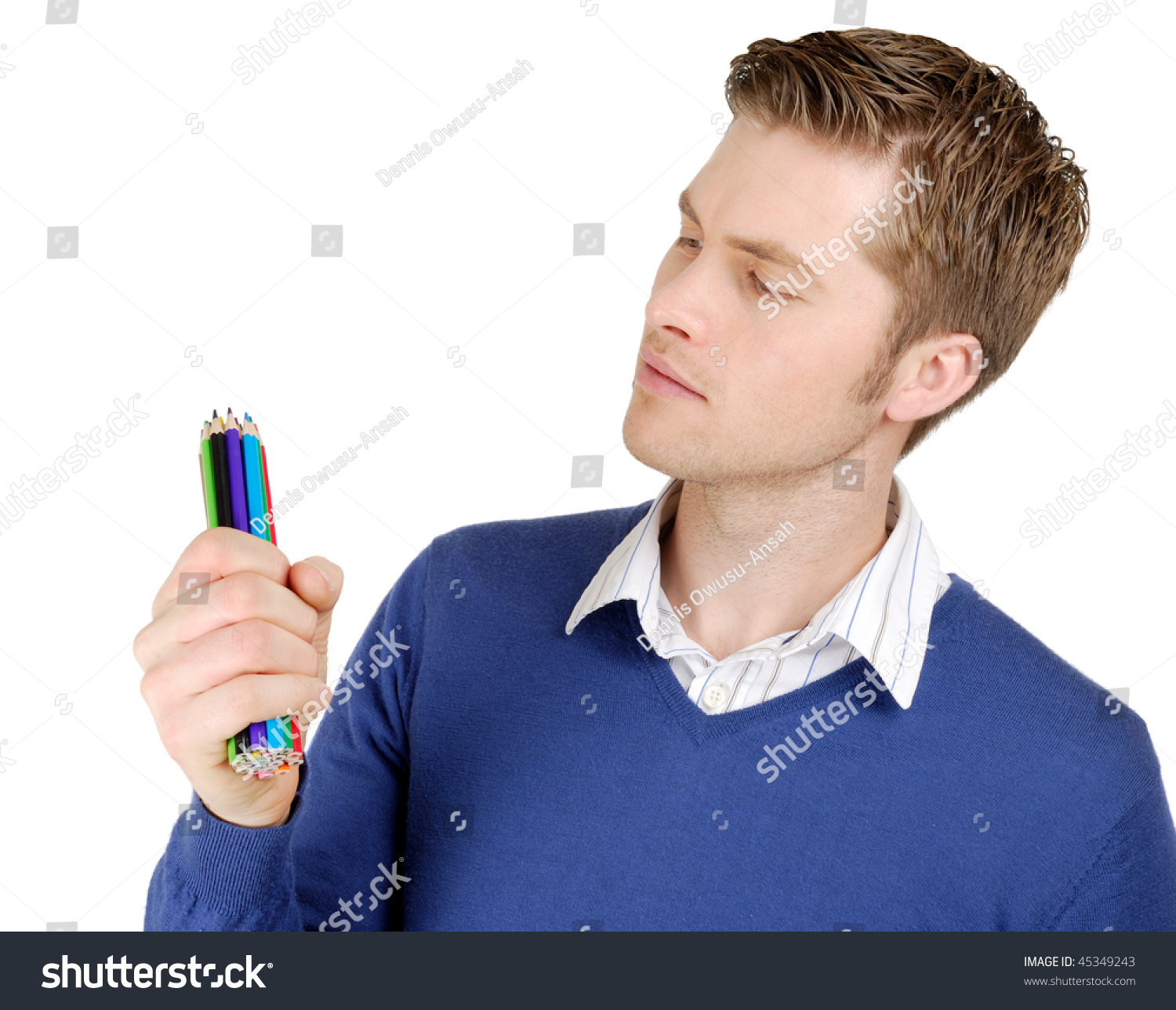 This is an image of caucasian man looking at color pencils. #45349243