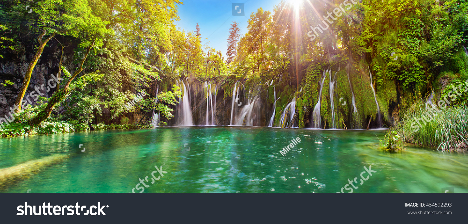 Breathtaking waterfalls panorama in Plitvice Lakes National Park, Croatia, Europe. Majestic view with turquoise water and sunset sunny beams, travel destinations background #454592293